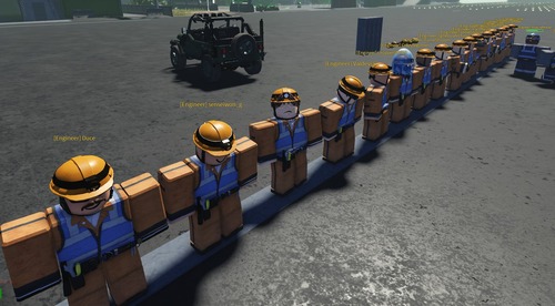 Engineering & Logistics personnel standing shoulder to shoulder